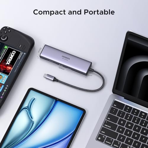 UGREEN Revodok 107 USB C集線器。 7合1底座,帶千兆乙太網。 4K@60Hz 高清多媒體介面(High Definition Multimedia Interface) 100W PD充電。 SD/TF讀卡器。 以及2個與MacBook相容的A類數據埠。 iPad。 iPhone 16/15 Pro Max:圖片 6